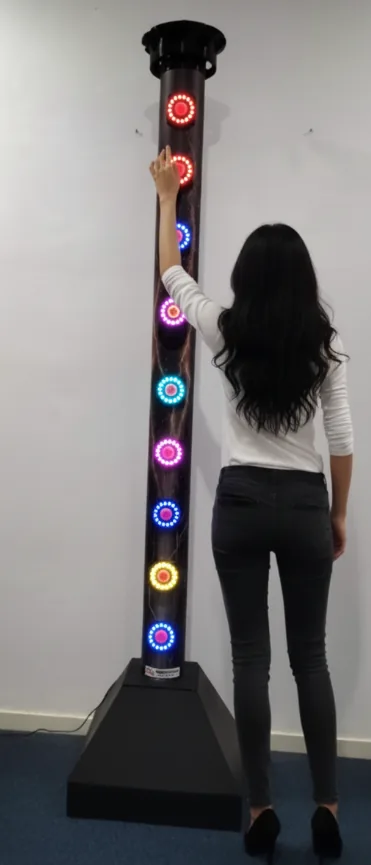 The Turbo Tower reaction-game machine with a column of illuminated target buttons.